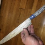 Custom kitchen knife from Houston Edge Works with detail on the blade